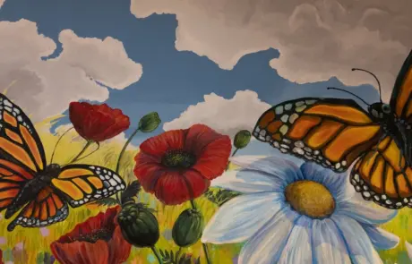 a mural of butterflies and flowers
