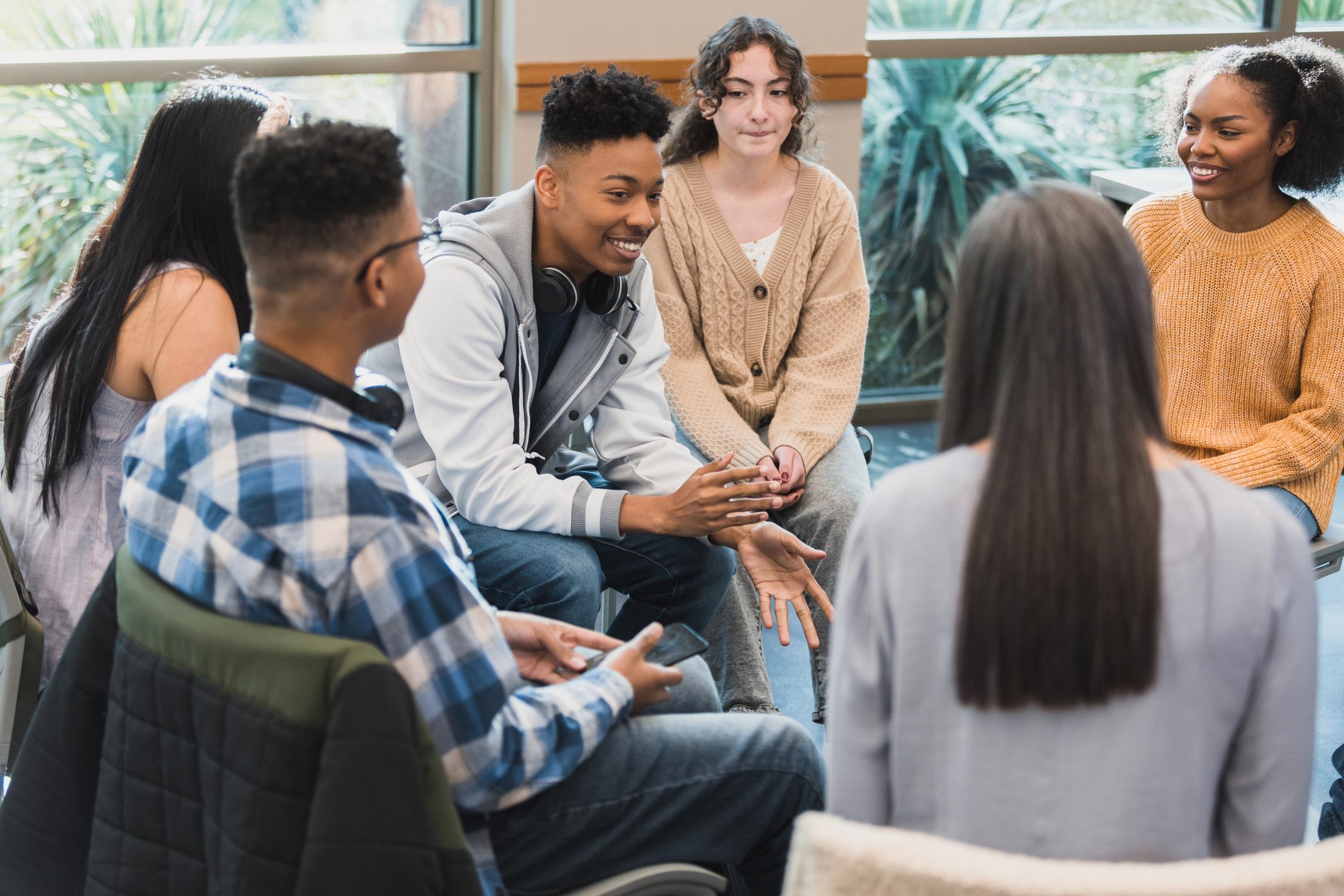 Teens sitting around and talking